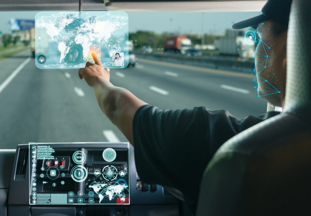 A truck driver searching for location on digital map realistically displayed screen.
